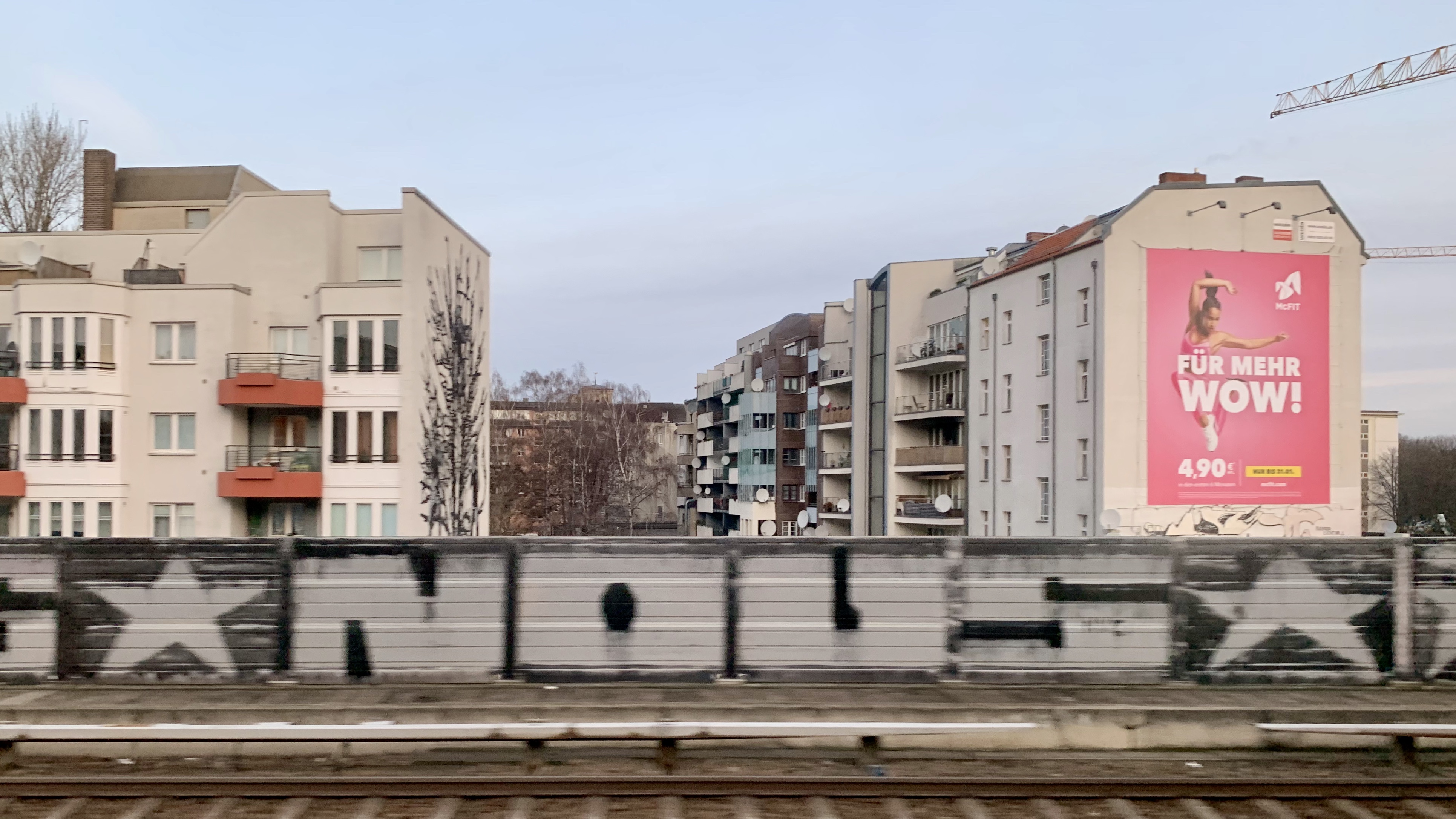 A McFit billboard as seen at Berlin walls.
